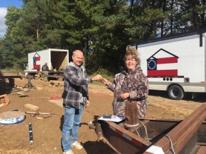 Happy homeowner getting keys to her new home.